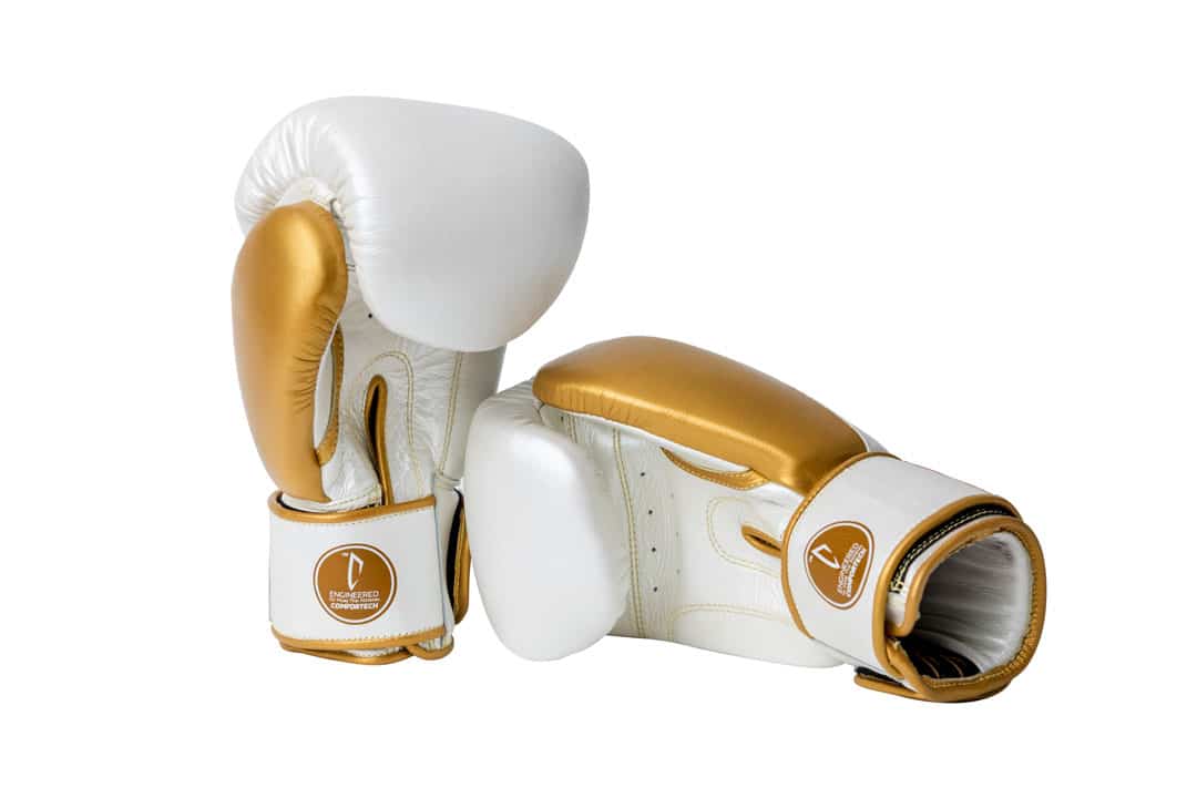 Corbetti CTG-005 Pearl White - Gold, Muay Thai Gloves, right one laying down on its side palm side forward and left standing up
