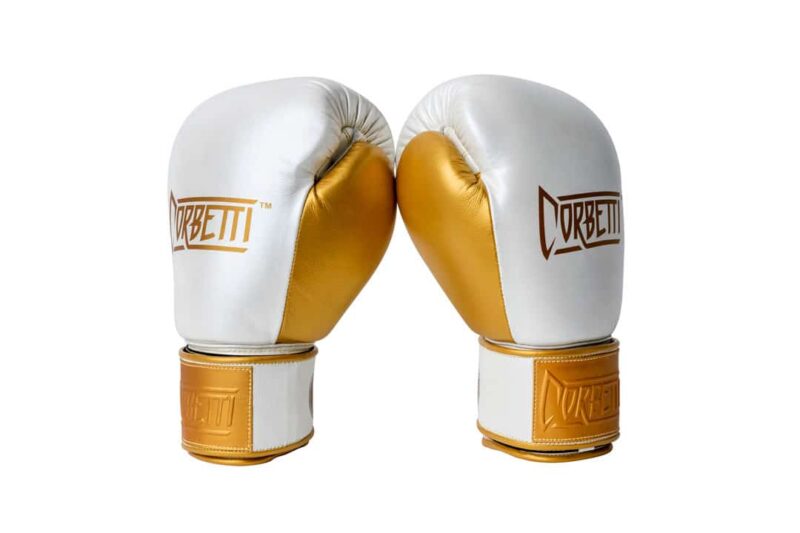 Corbetti CTG-005 Pearl White - Gold, Muay Thai Glove side by side standing up at an angle to showcase the metallic gold thumbs