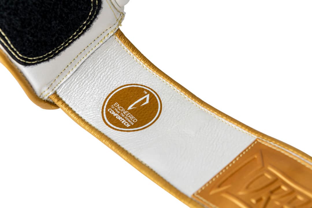 Corbetti CTG-005 Pearl White -Gold Muay Thai Glove wrist strap exhibiting the full grain leather and the comfortech technology