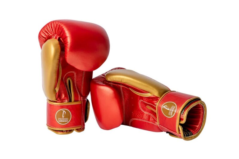 Corbetti CTG-002 Copper-Gold Muay Thai Gloves left one standing up and right one laying on its side both palm side forward