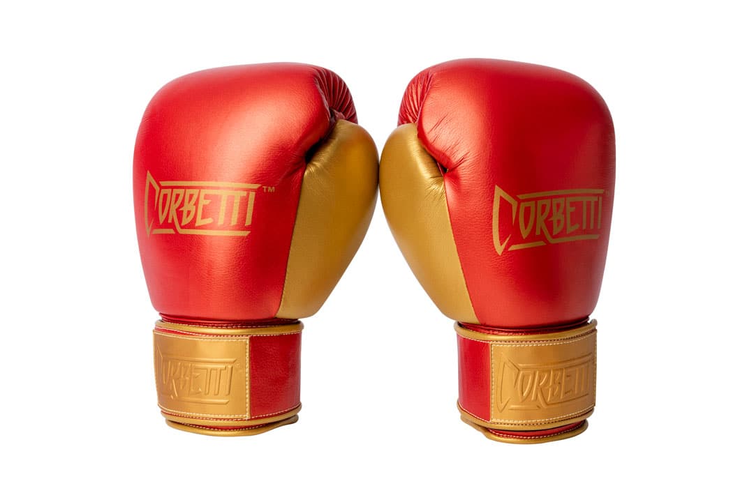 Corbetti CTG-002 Copper-Gold Muay Thai Gloves standing up at an angle side by side showing metallic gold thumbs