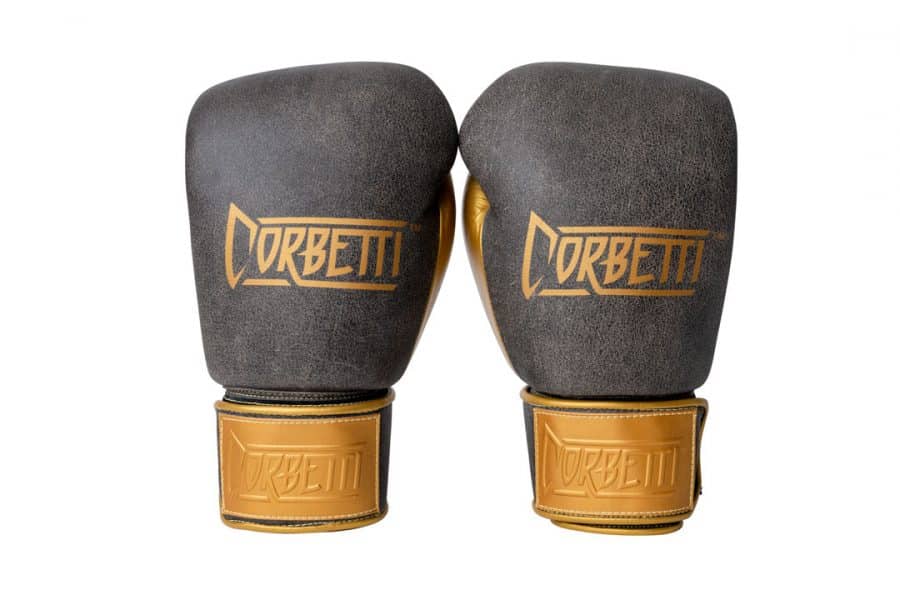 Corbetti CTG-006 Vintage-Gold Muay Thai Gloves both right and left hand gloves are standing up displaying the fist side brand logos