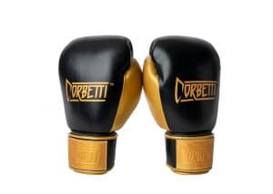 Corbetti CTG-001 Black-Gold Muay Thai Gloves both standing up fist side forward at an angle to showcase their metallic gold thumbs