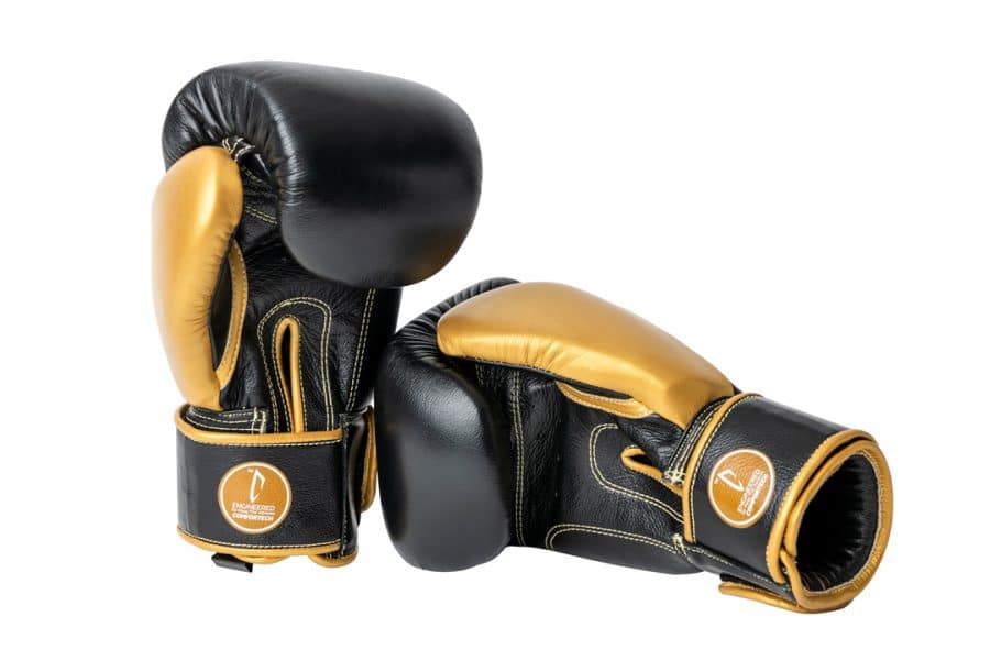 Corbetti CTG-001 Black-Gold Muay Thai Gloves left one is standing up and right one on its side touching the right with its fist both are in palm forward angles