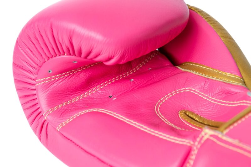 Corbetti CTG-004 Pink-Gold Muay Thai Glove detailed palm side view showcasing kevlar thread stitching
