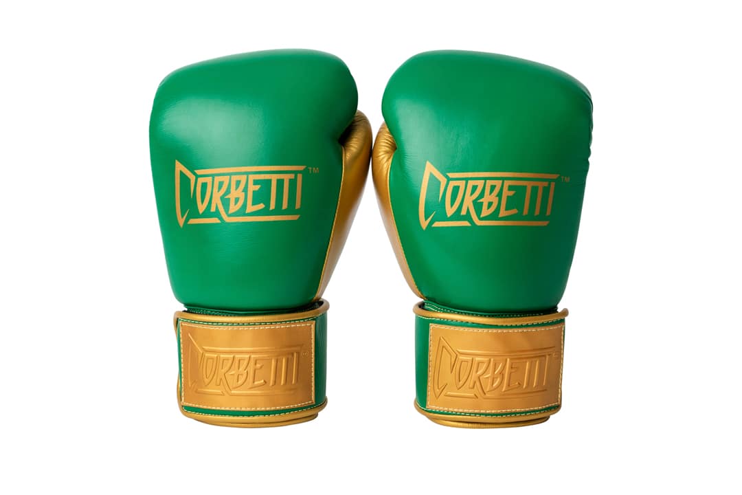 Corbetti CTG-003 Green-Gold Muay Thai Gloves both standing up fist side forward showcasing the brand's logos