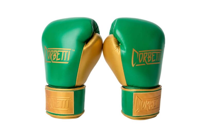 Corbetti CTG-003 Green-Gold Muay Thai Gloves both standing up at an angle fist side forward showcasing the gold thumbs and brand's logos